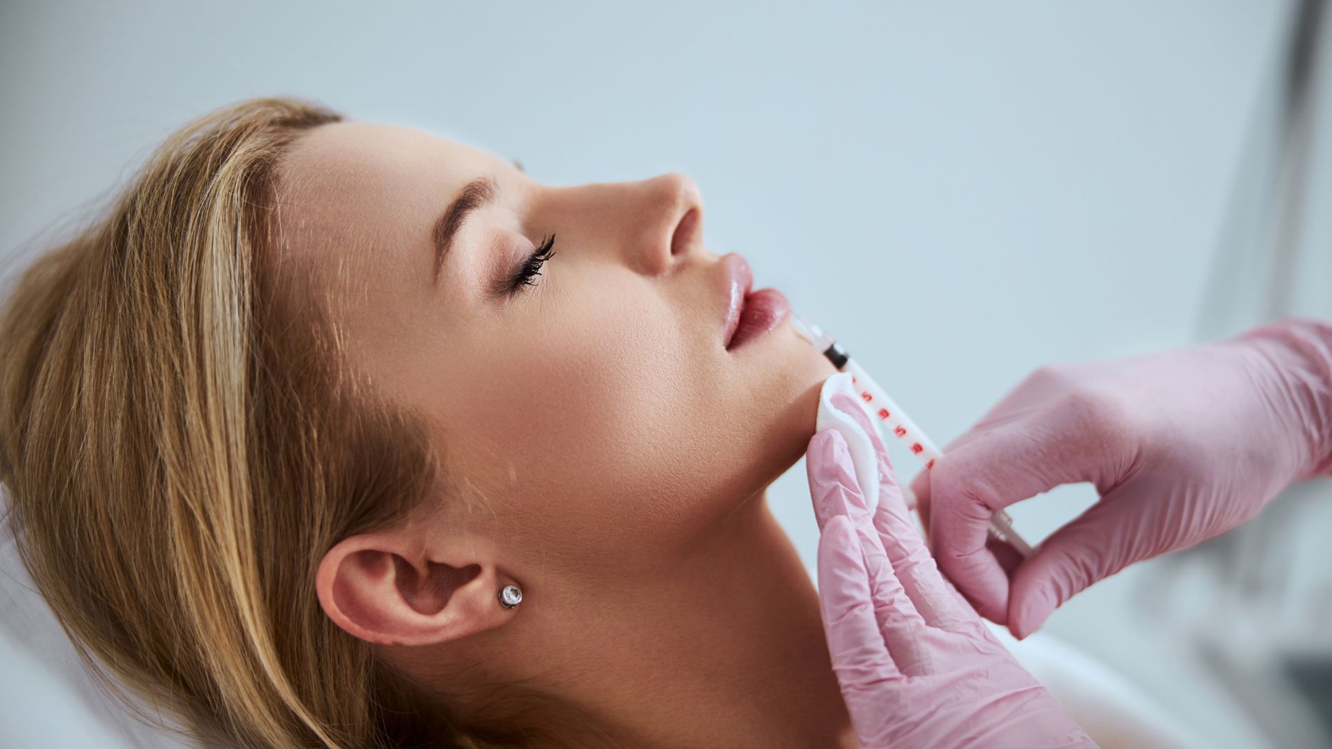 Woman receiving lip injections